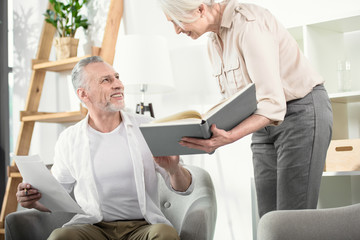Fototapeta premium Senior business colleagues discussing book at office