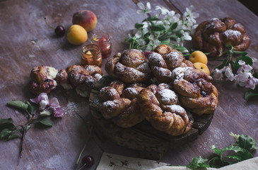 Fresh baked buns on wooden background