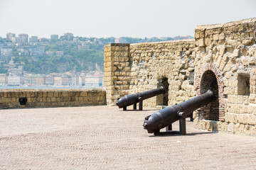 Fototapeta na wymiar Cannons in castle ovo, Naples, Italy