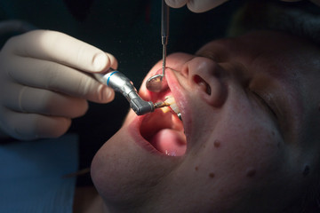 The dentist works with the client in the clinic