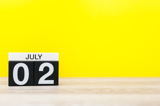 July 2nd. Image of july 2, calendar on yellow background. Summer time. With empty space for text