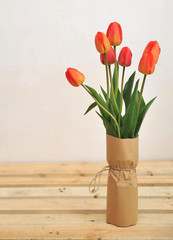 Tulips on a wooden background 