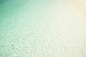 Crystal clear and turquoise sea water of the tropical sea .
