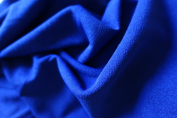 Draped bright electric blue smooth fabric