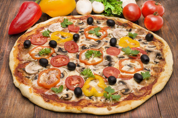 Pizza with ham, pepper and olives