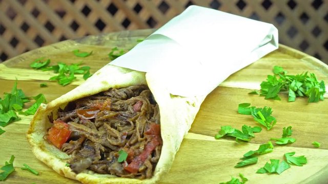 Turkish food lamb red meat wrapped, rotating