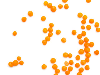 Red lentils on a white background