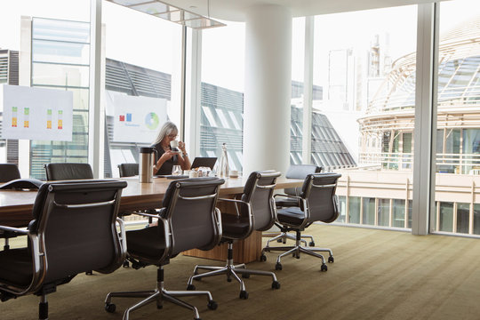 Businesswomen preparing presentation in meeting room