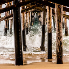 Beautiful image of water splashing under the pier