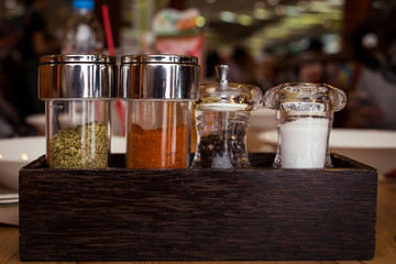 Condiments for pizza.in restaurant.