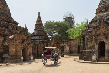 Bagan ancient pagodas and a horse carriage