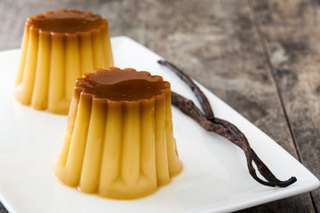 Creme caramel. Egg pudding on wooden table.

