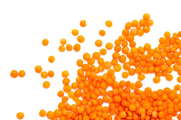 Red lentils on a white background