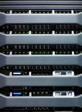 Detail of green led lights on data storage equipment in data centre