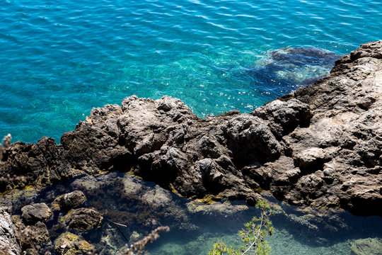 High angle view of rocks and blue sea, Dubrovnik, Croatia