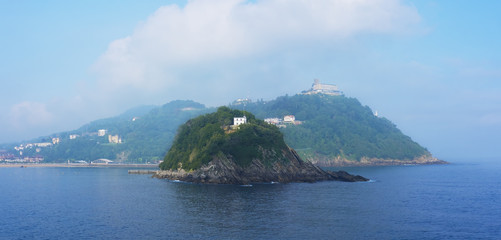 Santa Clara island with blue water in the city of San Sebastian, Euskadi