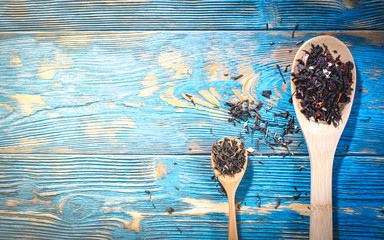 tea leaves in wooden spoons