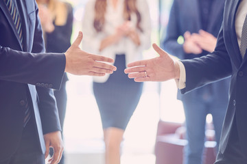 Business people shaking hands