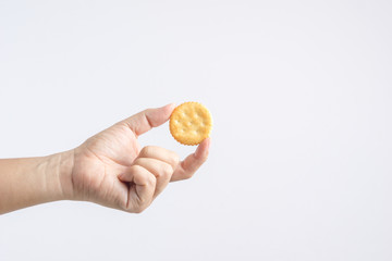 Fototapeta na wymiar Hand holding round biscuit