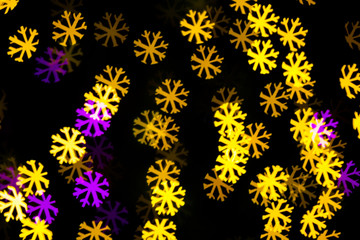Abstract Yellow Purple lights snow flake bokeh background