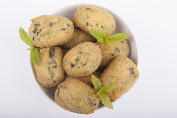 a handful of homemade croquettes of spinach isolated on white