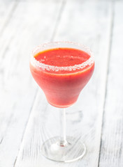 Glass of strawberry margarita cocktail