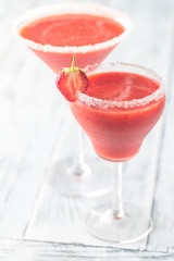 Two glasses of strawberry margarita cocktail