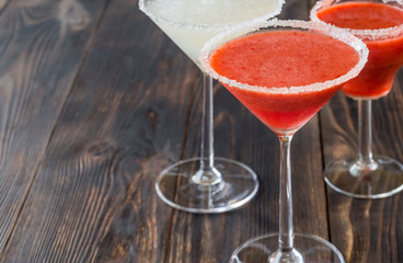 Glasses of lime and strawberry margarita cocktail