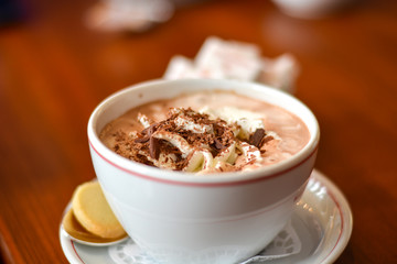 Hot chocolate with cream and chocolate grating on top