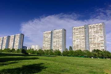Obraz premium Beautiful high-rise city houses against the blue sky