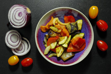 baked vegetables in a bowl. healthy vegetarian meal