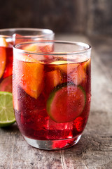 Sangria drink in glass on wooden table
