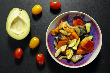 baked vegetables in a bowl. healthy vegetarian meal
