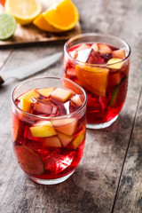Sangria drink in glass on wooden table
