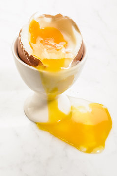 three minutes cooked, open egg in an egg cup