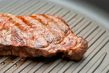 Steak grilled in a frying pan