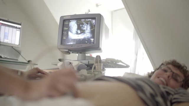 Doctor Screening By Ultrasound Of Pregnant Woman