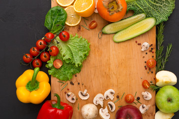 Frame of fresh vegetables on wooden background with copy space