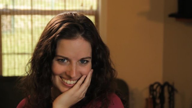 Close up, woman plays coy