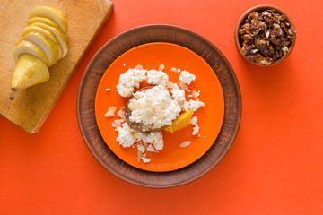 Healthy breakfast - cottage cheese, nuts and fruit