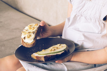 Sweet homemade sandwiches in the hands of a child