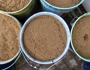 Containers, buckets with earth, top view