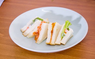 delicious sandwich with ham vegeable bread on  white dish , home made sandwich, health food