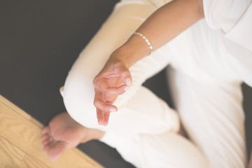 Woman practicing yoga at studio