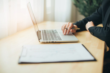 Fototapeta premium Professional business woman at work with laptop hands close up