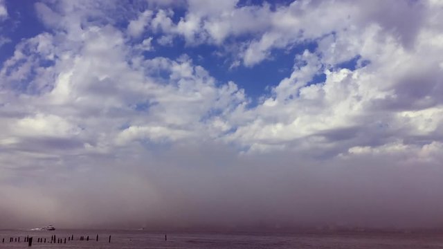 Dramatic foggy weather on the Hudson River lifting to reveal the New Jersey skyline in a time lapse view from New York City