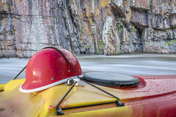 kayaking helmet on kayak deck