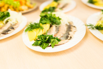 Dish with sliced fish products on the festive table