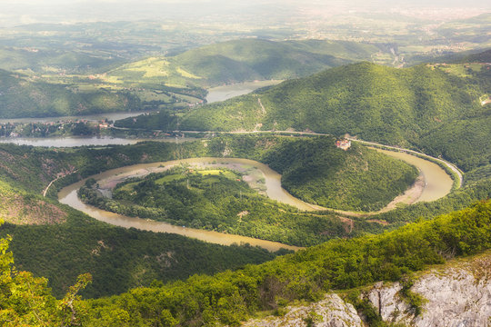 Ovcar Kablar Gorge, Serbia.   Meanders of  West Morava river,  view from the top of the Kablar mountain. Dramatic morning lights and shadows in springtime