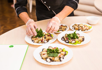 Obraz na płótnie Canvas Close-up of chef cooking food kitchen restaurant cutting cook hands hotel man male knife preparation fresh preparing concept